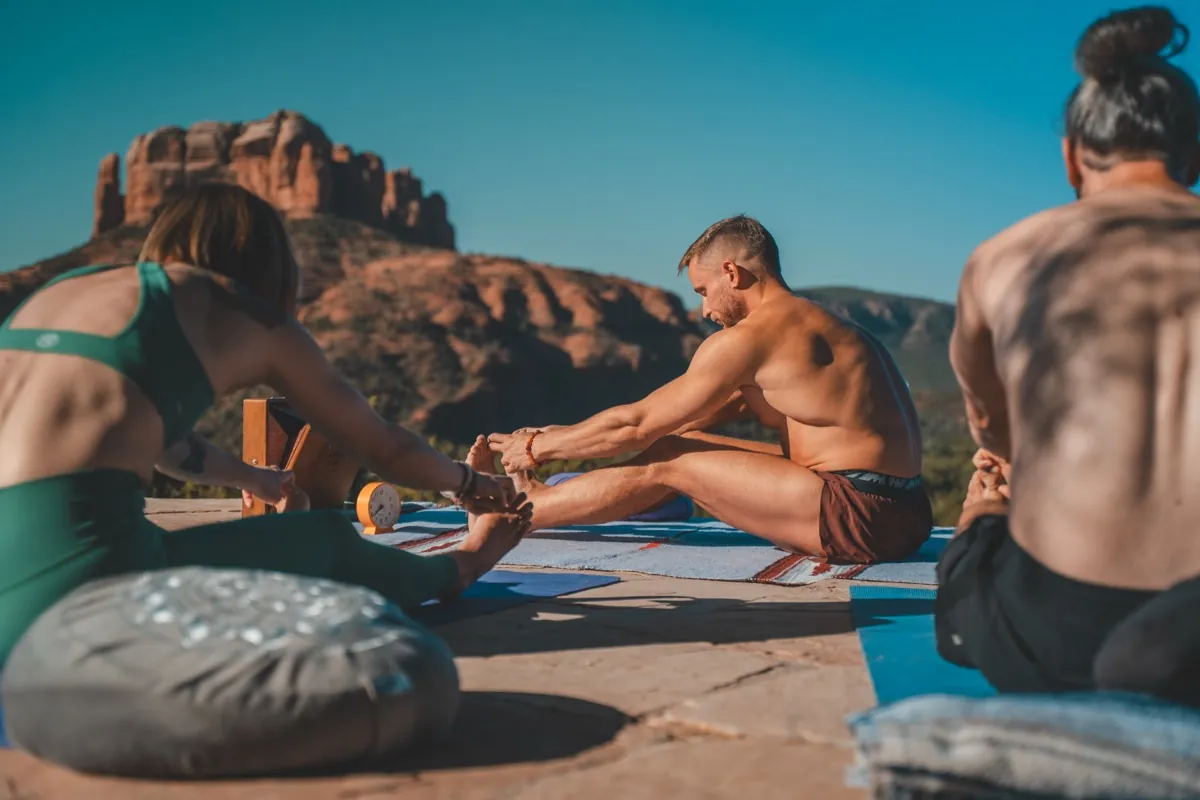 Outdoor yoga and stretching with Cathedral Rock, Sedona retreat